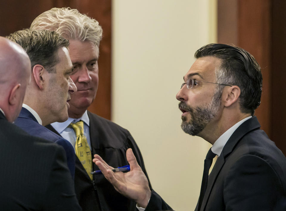 In this Monday, June 3, 2019 photo, State Judge Eugene Griffith, third from left, listens as 11th Circuit Solicitor Rick Hubbard, second from left, and defense attorney Casey Secor, right, discuss an objection during the murder trial of Timothy Jones Jr. at the Lexington County Courthouse in Lexington, Ky. Jurors are again deliberating whether the South Carolina father is guilty of murder in the deaths of his five children. (Jeff Blake/The State via AP, Pool)