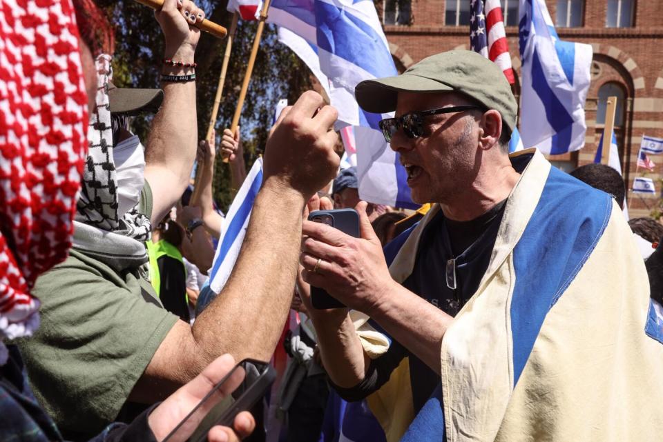 Two protesters face off at close range.