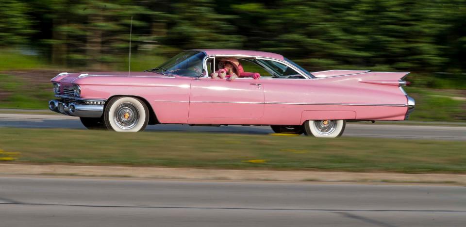 A pink 1959 Cadillac Coupe de Ville screams the excess of 1950s styling.