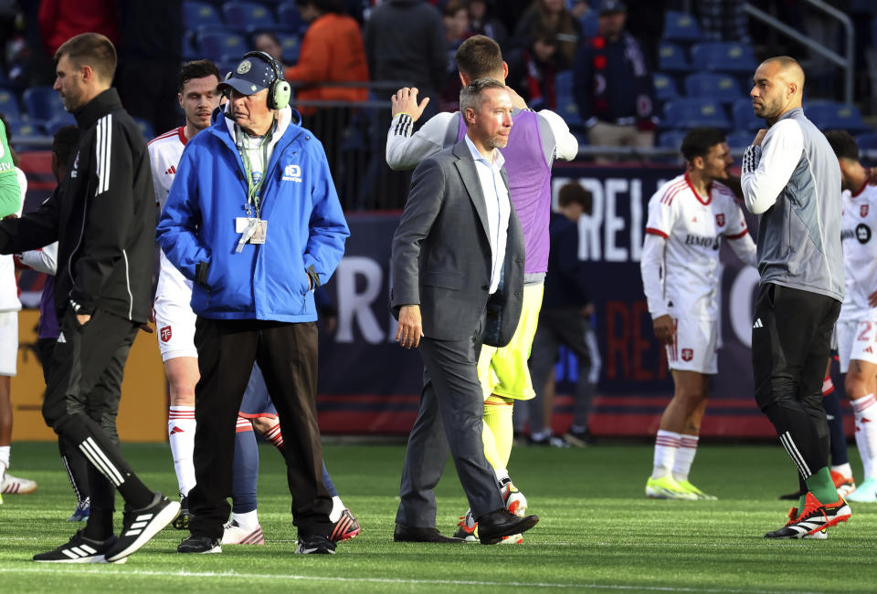 New England Revolution head coach Caleb Porter, center, walks off the field at the end of an MLS soccer match after losing to Toronto FC, Sunday, March 3, 2024, in Foxborough, Mass. (AP Photo/Mark Stockwell)