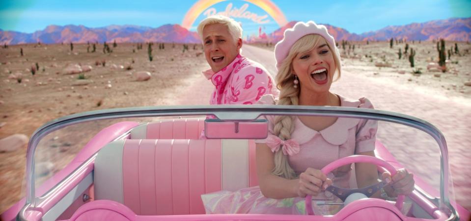 barbie and ken in convertible from the barbie movie