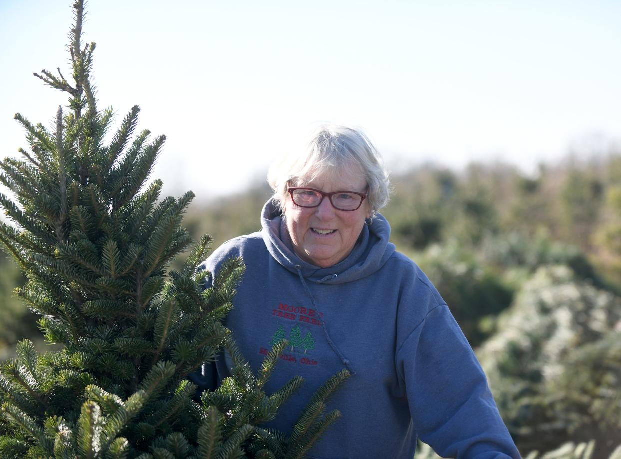 Jean Polack, owner of Moore's Christmas Tree Farm in Marlboro Township, prepares for the holidays. She advises people to give their tree plenty of water when they first get it home.