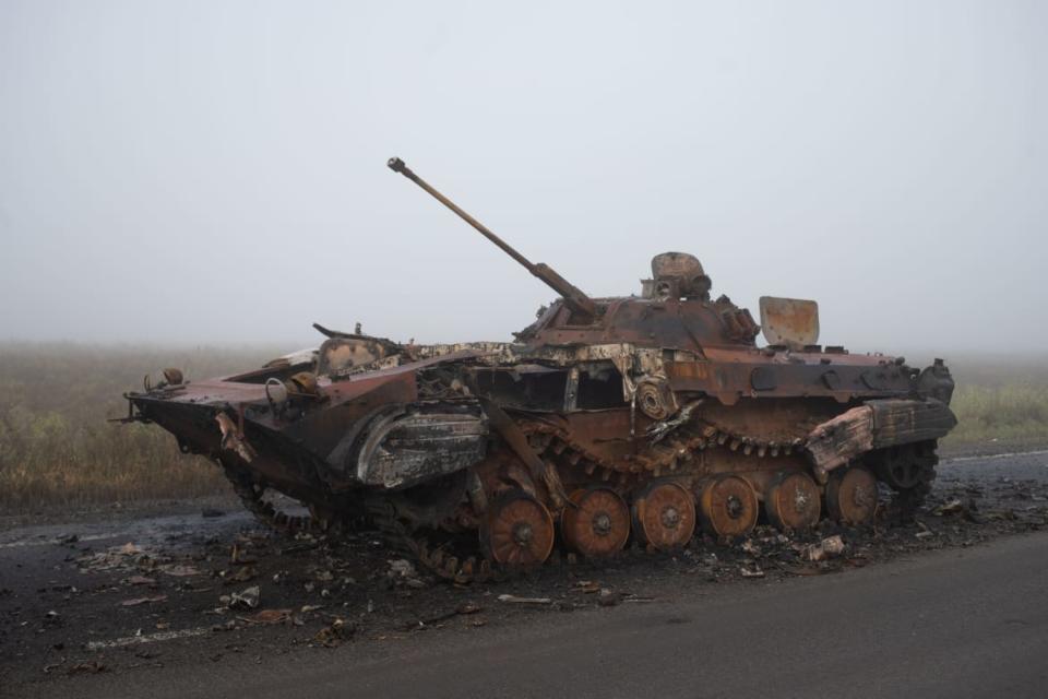 <div class="inline-image__caption"><p>A destroyed Russian armoured vehicle on the road to Izyum.</p></div> <div class="inline-image__credit">Tom Mutch</div>