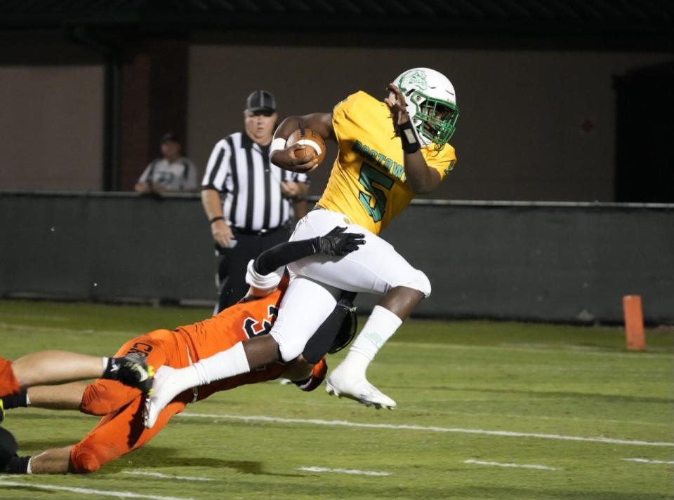 TJ Moore surpassed 1,000 yards passing and rushing, guiding DeLand to its first district championship in a decade.