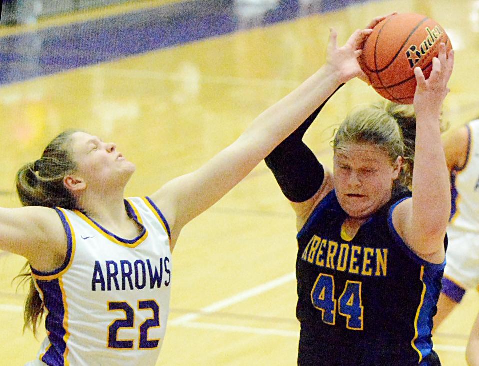 Aberdeen Central's Taryn Hermansen (44) snares a rebound against Watertown's Grace Corey during their high school girls basketball game on Monday, Feb. 20, 2023 in the Watertown Civic Arena.