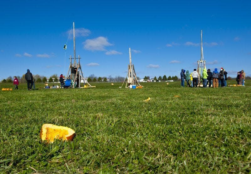 Teams compete in the Bloomington Pumpkin Launch at a past event at the Monroe County Fairgrounds. Though some of the trebuchets and launchers could hurl pumpkins more than 400 feet, sometimes technical difficulties caused the pumpkins to be thrown backwards.
