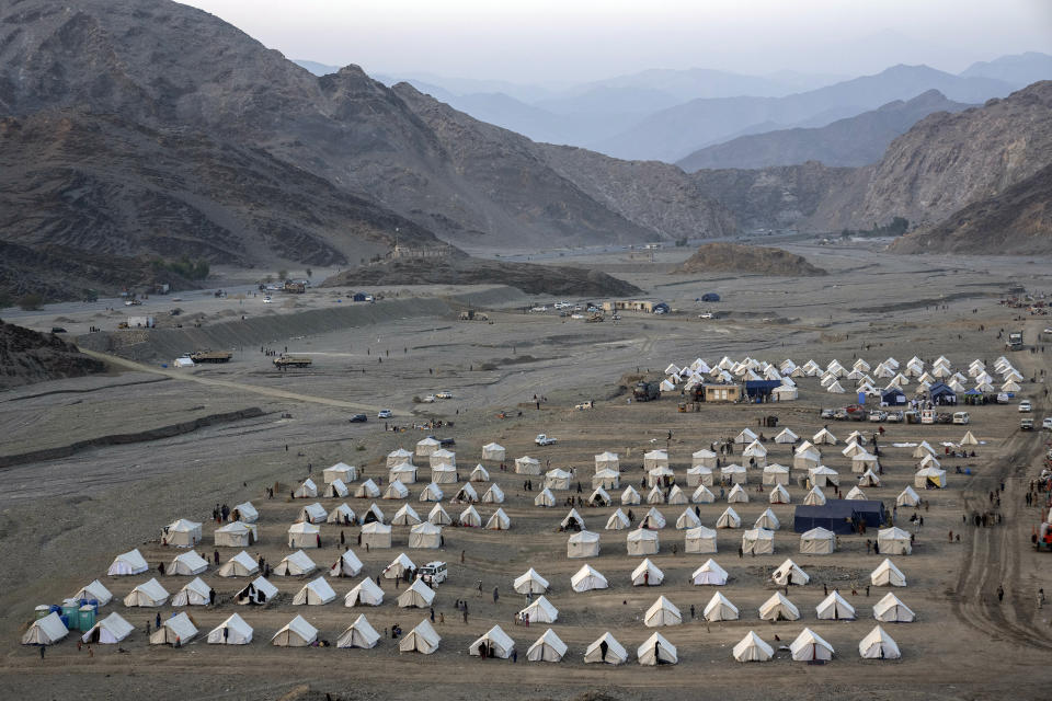 A general view of a camp where Afghan refugees are accommodated at in the Torkham Pakistan-Afghanistan border, in Torkham, Afghanistan, Friday, Nov. 3, 2023. A huge number of Afghan refugees entered the Torkham border to return home hours before the expiration of a Pakistani government deadline for those who are in the country illegally to leave or face deportation. (AP Photo/Ebrahim Noroozi)