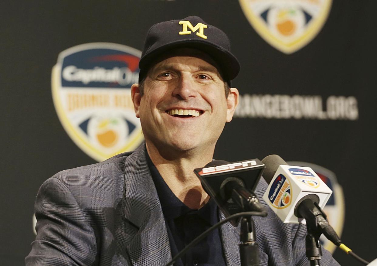 Michigan head coach Jim Harbaugh smiles during a news conference in Fort Lauderdale, Fla., Thursday, Dec. 29, 2016. Michigan plays Florida State in the Orange Bowl Friday. (AP Photo/Marta Lavandier)