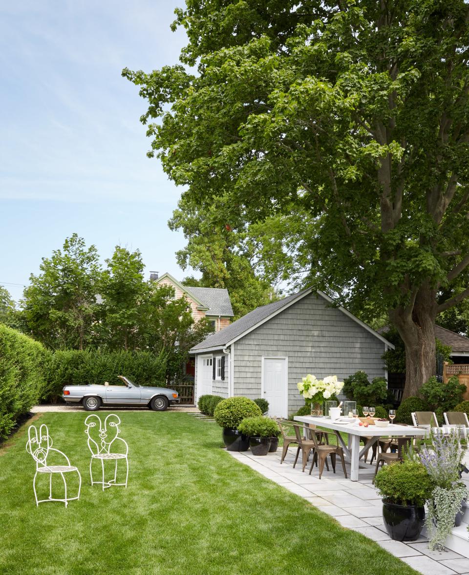 Front yard with large lawn and garage