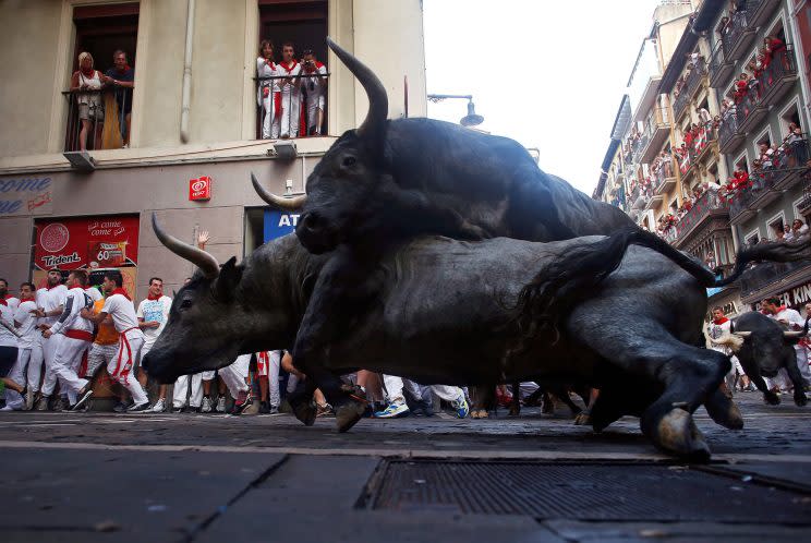 Jose Escolar Gil fighting bulls fall on top of each other at Estafeta corner during the third running of the bulls at the San Fermin festival in Pamplona, northern Spain, July 9, 2016. (Photo: Eloy Alonso/REUTERS)