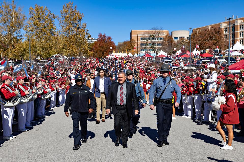 FAYETTEVILLE, ARKANSAS - NOVEMBER 05: Head Coach Sam Pittman of the Arkansas Razorbacks walks with the team to the stadium before a game against the Liberty Flames at Donald W. Reynolds Razorback Stadium on November 05, 2022 in Fayetteville, Arkansas. (Photo by Wesley Hitt/Getty Images)