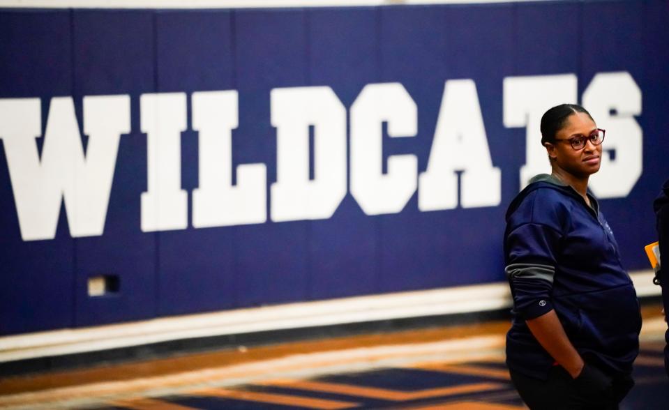 Estero Wildcats assistant coach Taylor Reid listens during a timeout in the team’s game against the Riverdale Raiders at Estero High School on Tuesday, Oct. 3, 2023.