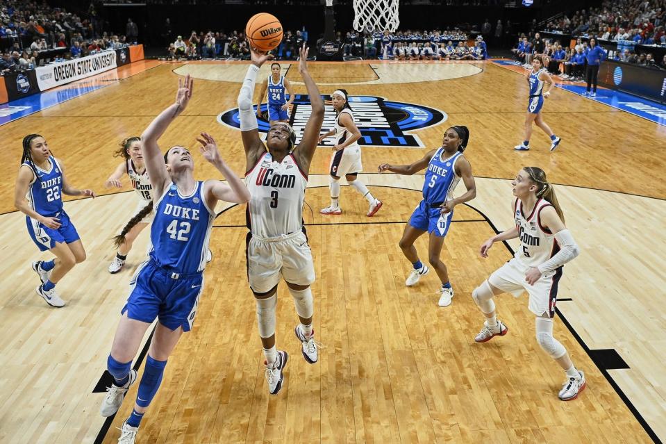 Connecticut's Aaliyah Edwards grabs a rebound in Saturday's regional semfinal win over Duke at the Moda Center in Portland, Oregon.