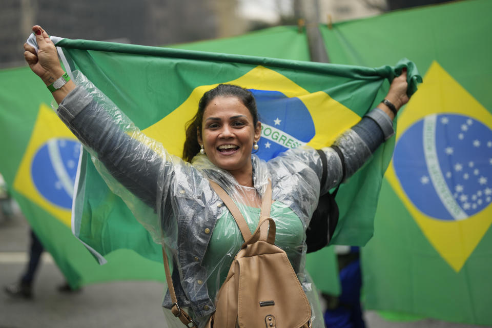 A supporter of Brazilian President Jair Bolsonaro, who is running for a second term, attends a demonstration to celebrate the bicentennial of the country's independence in Sao Paulo, Brazil, Wednesday, Sept. 7, 2022. (AP Photo/Andre Penner)