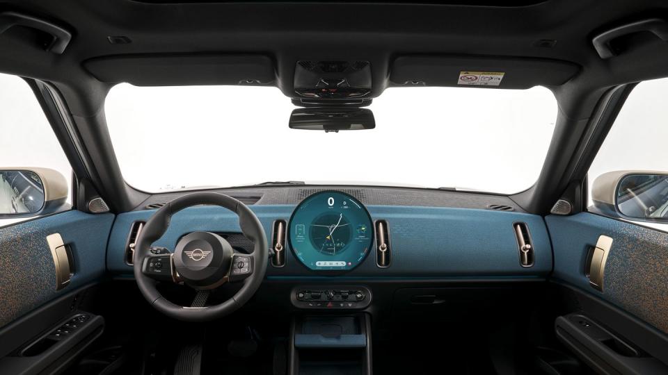 2025 mini cooper countryman electric in light blue with a cream and black interior