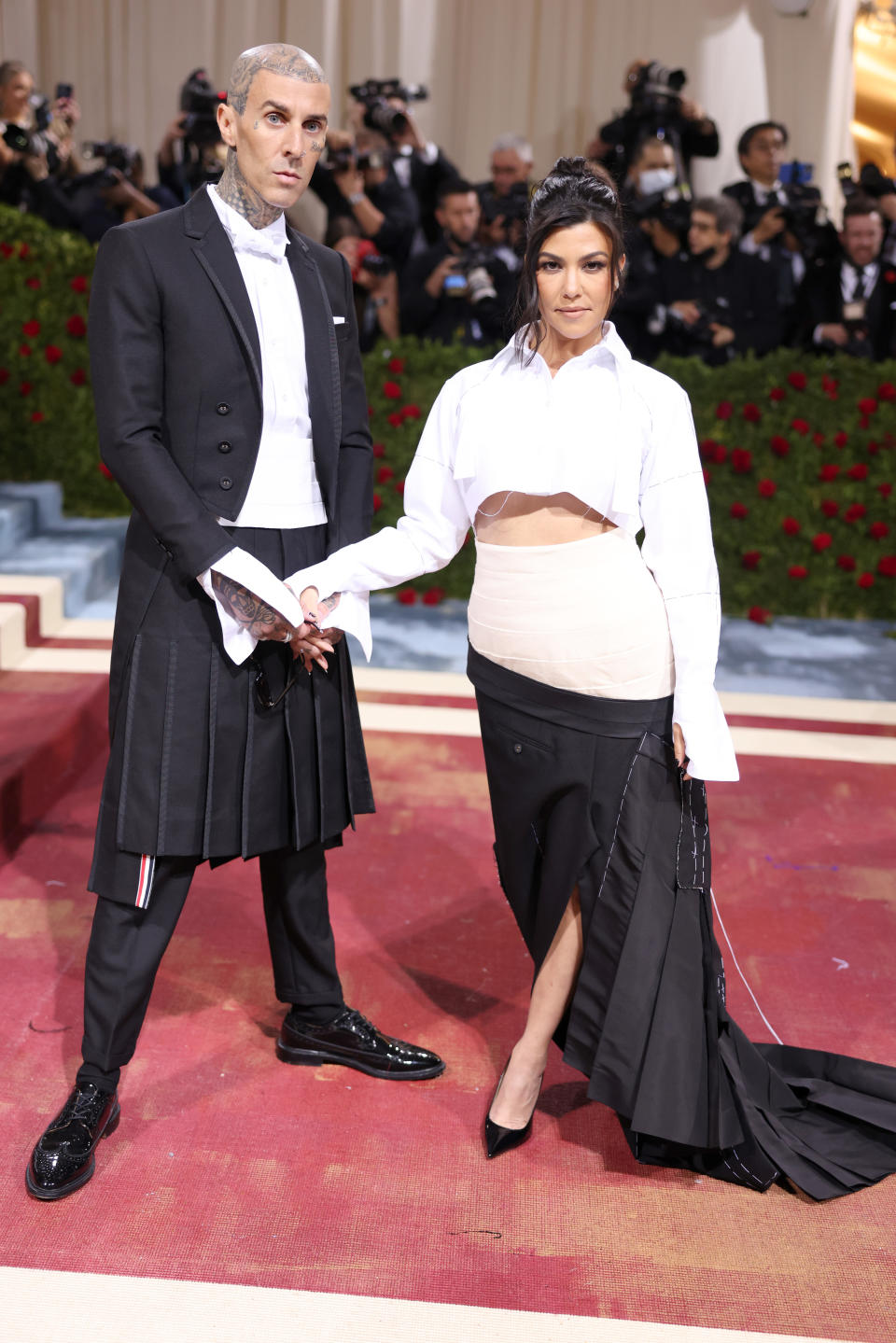 Travis Barker and Kourtney Kardashian attend The Met Gala.