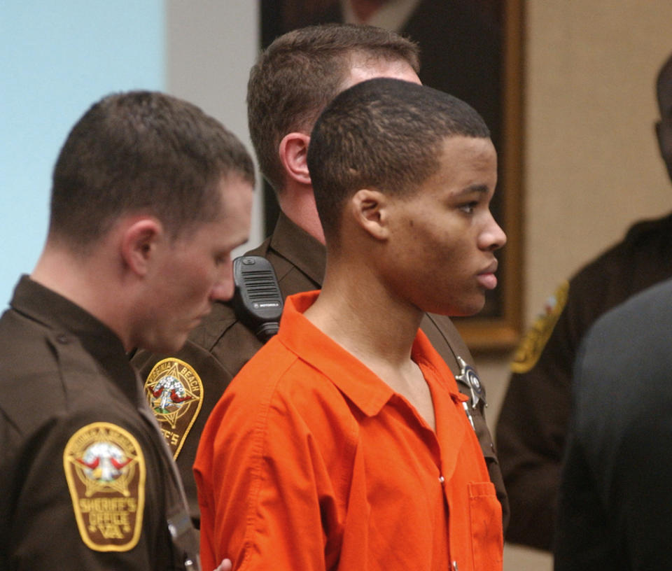 FILE - Lee Boyd Malvo listens to court proceedings during the trial of fellow sniper suspect John Allen Muhammad in Virginia Beach, Va., Oct. 20, 2003. Virginia has denied parole to convicted sniper killer Malvo, ruling that he is still a risk to the community two decades after he and his partner terrorized the Washington, D.C., region with a series of random shootings. The Virginia Parole Board rejected his request on Aug. 30, 2022. (AP Photo/Martin Smith-Rodden, Pool, File)