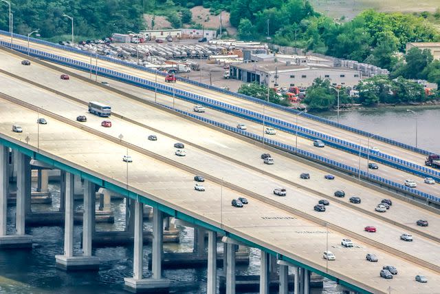 <p>Getty</p> Aerial shot of the Garden State Parkway road over the Raritan River.