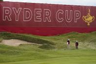 Marshalls stand near the green on the first hole during a practice day at the Ryder Cup at the Whistling Straits Golf Course Wednesday, Sept. 22, 2021, in Sheboygan, Wis. (AP Photo/Jeff Roberson)