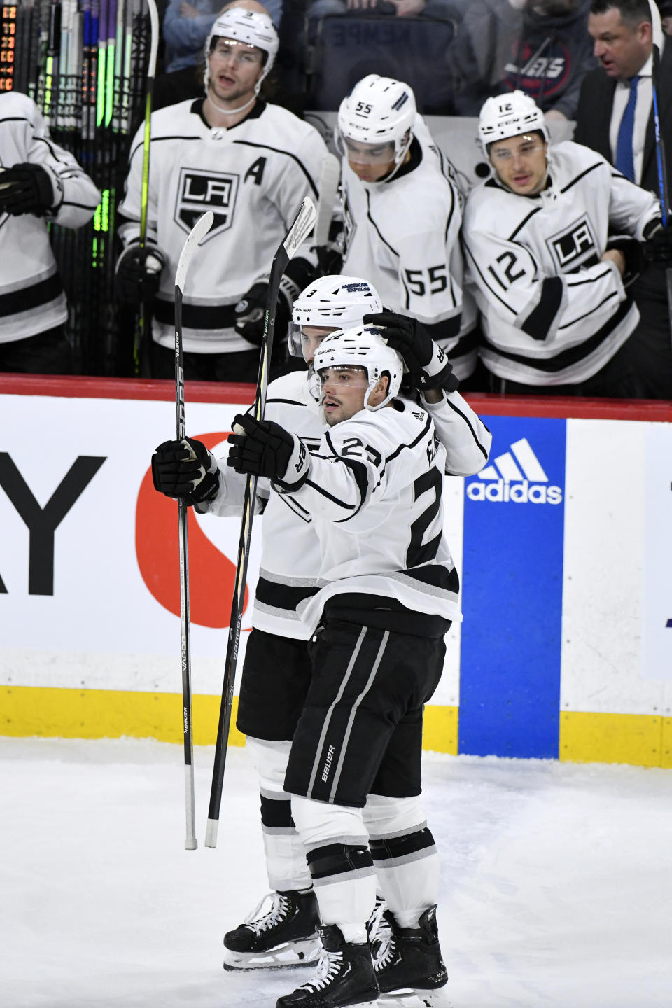 Los Angeles Kings' Kevin Fiala (22) celebrates his goal against the Winnipeg Jets with teammate Matt Roy (3) during the second period of an NHL hockey game in Winnipeg, Manitoba, on Monday, April 1, 2024. (Fred Greenslade/The Canadian Press via AP)