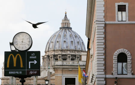 A McDonald's sign is seen at Via della Conciliazione street in Rome, Italy in front of Vatican City's St. Peter's Square January 3, 2017. REUTERS/Alessandro Bianchi