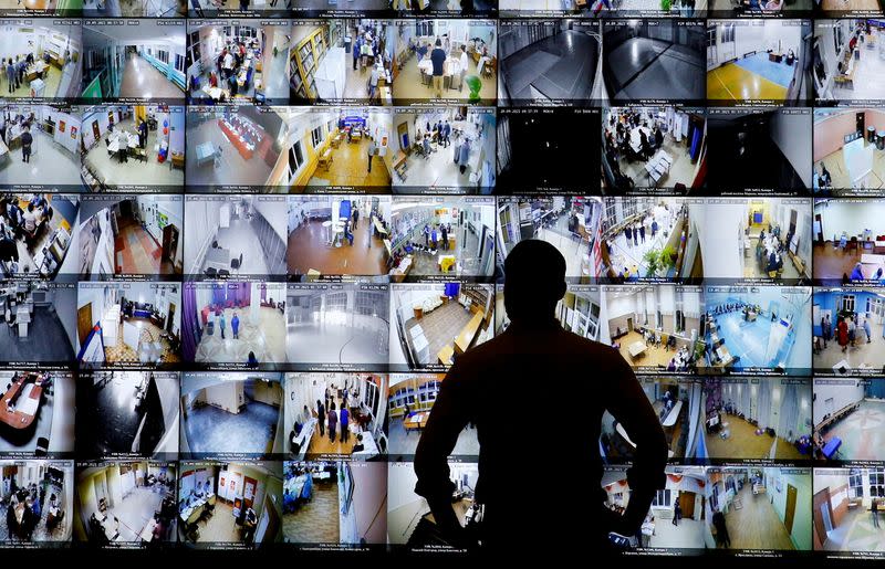 FILE PHOTO: A man looks on a screen showing polling stations, at the headquarters of Russia's Central Election Commission in Moscow