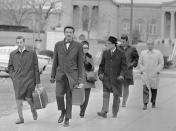 <p>The trial of the “Watergate Seven,” the men accused of bugging the headquarters of the Democratic National Committee in June, 1972, opened in Washington, D.C., on Jan 8, 1973. Shown arriving, left to right, are: Virgilio Gonzales; Henry Rothblatt, attorney; Bernard Baker; Frank Sturgis; and Eugenio Martinez. The woman is unidentified. (Photo: Bettmann/Getty Images) </p>