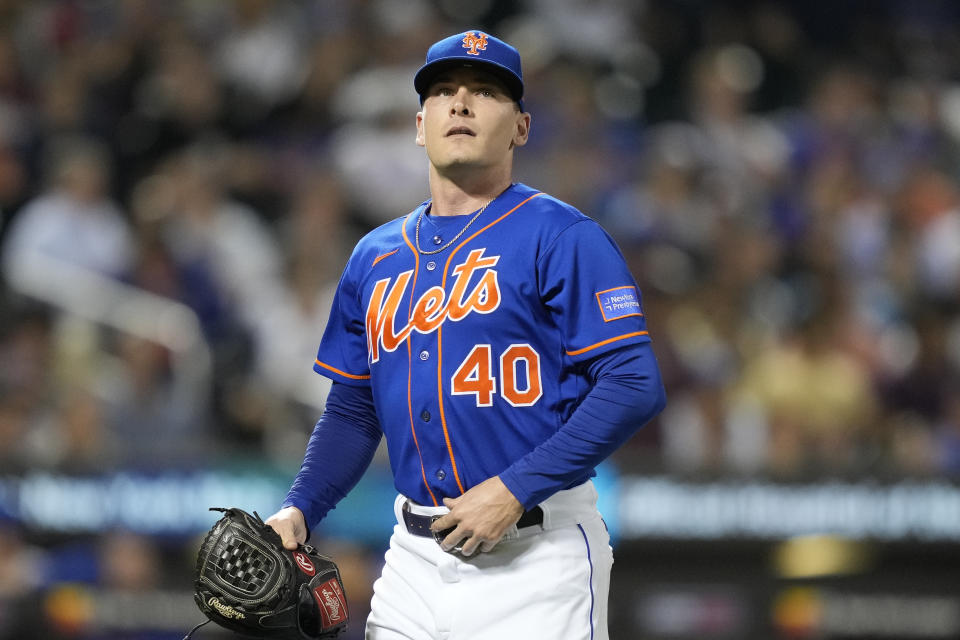 New York Mets relief pitcher Drew Smith (40) is relieved after giving up a solo home run to Chicago Cubs' Mike Tauchman in the eighth inning of a baseball game, Tuesday, Aug. 8, 2023, in New York. (AP Photo/John Minchillo)