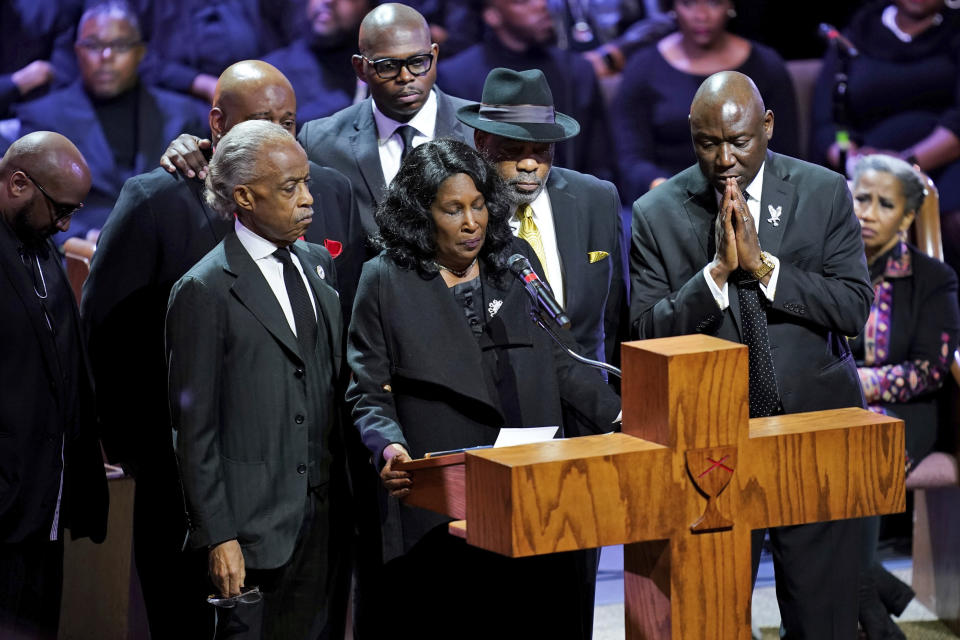 Flanked by Rev. Al Sharpton, left, her husband Rodney Wells, second from right, and attorney Benjamin Crump, right, RowVaughn Wells speaks during the funeral service for her son Tyre Nichols at Mississippi Boulevard Christian Church in Memphis, Tenn., on Wednesday, Feb. 1, 2023. Nichols died following a brutal beating by Memphis police after a traffic stop. (Andrew Nelles/The Tennessean via AP, Pool)