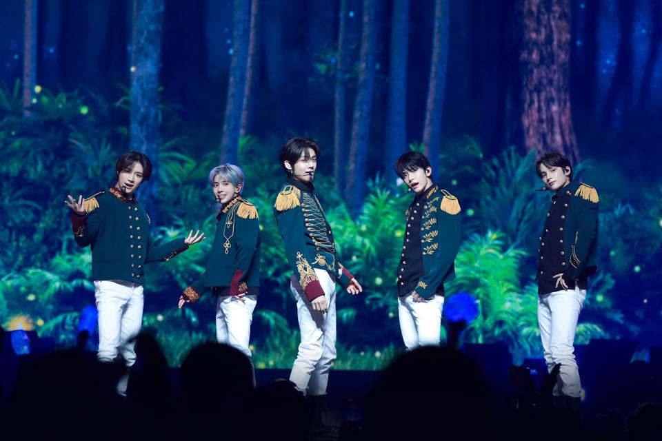 (L-R) Beomgyu, Taehyun, Yeonjun, Soobin and Hueningkai of Tomorrow X Together perform at the Capital One Arena in Washington D.C. on May 16, 2022.