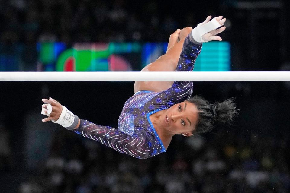 Simone Biles of the United States competes on the uneven in the women’s gymnastics all-around during the Paris 2024 Olympic Summer Games at Bercy Arena.