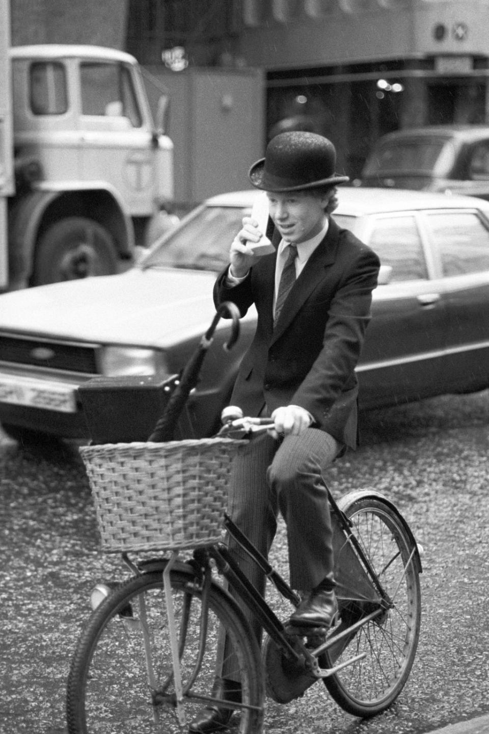 Nicholas Pearce, managing director of Cellular One, speaking directly to the US whilst cycling through London traffic with the first truly portable telephone (PA) (PA Archive)