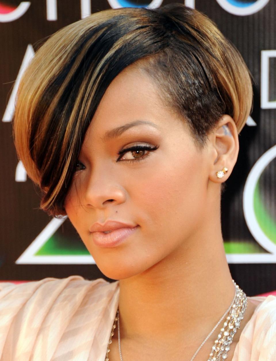 <p>What's more to love about singer <strong>Rihanna's </strong>throwback style, the color or the cut? Not to mention, the deep side part and major swoop gives this look sexy yet sweet vibes. </p>