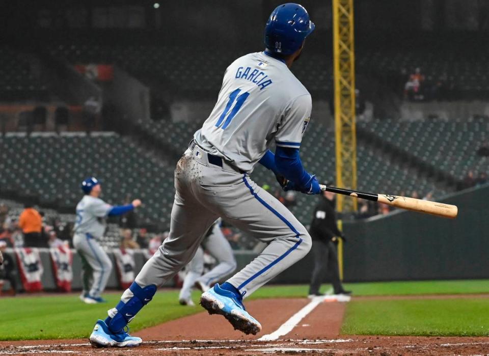 Kansas City Royals third baseman Maikel Garcia (11) swings through a two-run double in the second inning of a game against the Baltimore Orioles at Oriole Park at Camden Yards on April 2, 2024.