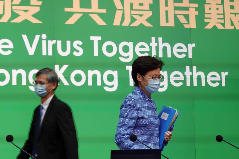 Hong Kong Chief Executive Carrie Lam wearing a face mask arrives for a news conference in Hong Kong