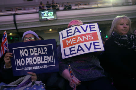 Brexit supporters hold signs during a "Leave Means Leave" rally in London, Britain January 17, 2019. REUTERS/Simon Dawson