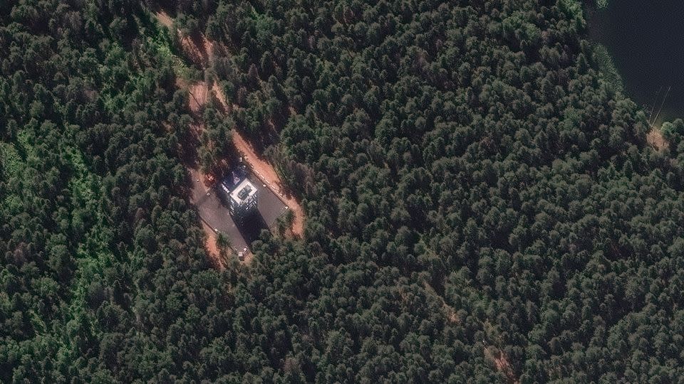 A satellite image provided by Maxar Technologies shows an air defense system placed on a tower in a forest near Putin's summer residence. - Courtesy: Maxar Technologies