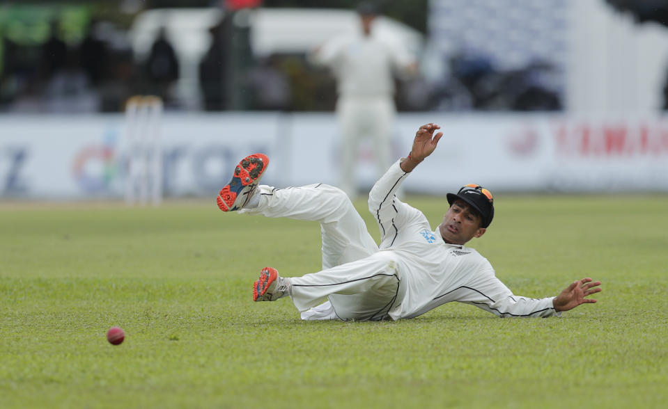 New Zealand's Jeet Raval misfields a ball during the first day of the second test cricket match between Sri Lanka and New Zealand in Colombo, Sri Lanka, Thursday, Aug. 22, 2019. (AP Photo/Eranga Jayawardena)