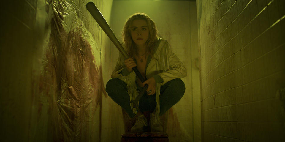 Jamie with a baseball bat, hiding in a bathroom.