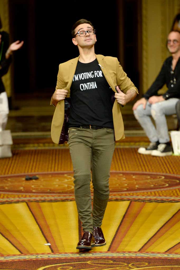 <p>At the end of his show, Christian Siriano walked the runway wearing his own statement T-shirt that read, “I’m Voting for Cynthia.” The 2018 New York gubernatorial primary is taking place on Sept. 13. (Photo: Getty) </p>