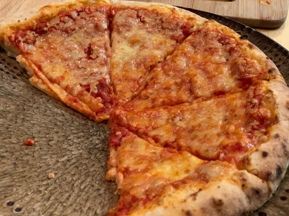 cooked Slices of Trader Joe's three cheese pizza