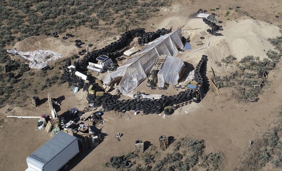 FILE - A ramshackle compound is seen in the desert area of Amalia, N.M., on Aug. 10, 2018. A U.S. judge is expected to hand down sentences Wednesday, March 6, 2024, for five defendants in a federal terrorism and kidnapping case that stemmed from the search for a toddler who went missing from Georgia in late 2017 that ended months later with a raid on the squalid compound in northern New Mexico. (AP Photo/Brian Skoloff, File)