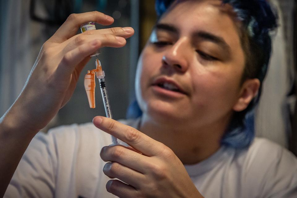 Rito Hendrix, 31, prepares his weekly injection of testosterone at his family's home in unincorporated Palm Beach County, Fla., on May 12, 2023.