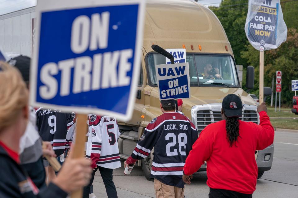 UAW Strikers slow a truck from entering the Ford Michigan Assembly Plant in Wayne on Monday, Sept. 18, 2023.