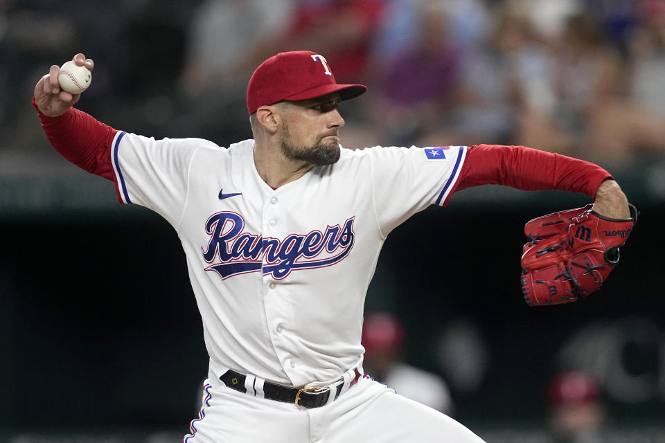 Texas Rangers starting pitcher Nathan Eovaldi throws to the Houston Astros in the first inning of a baseball game, Tuesday, Sept. 5, 2023, in Arlington, Texas. (AP Photo/Tony Gutierrez)