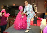 <p>RuPaul cut the ribbon for the opening of the first RuPaul’s DragCon NYC, an all-ages, family-friendly celebration of drag culture, alongside 10-year-old Desmond is Amazing, one of the two-day event’s many featured guests. (Photo: World of Wonder) </p>