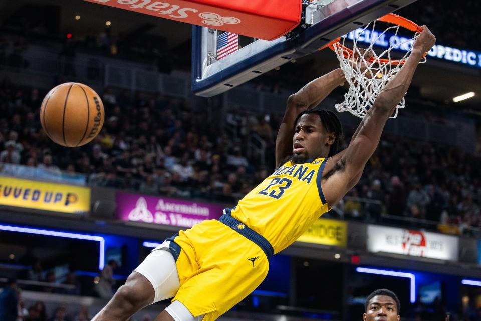 Mar 29, 2024; Indianapolis, Indiana, USA; Indiana Pacers forward Aaron Nesmith (23) shoots the ball in the first half against the Los Angeles Lakers at Gainbridge Fieldhouse. Mandatory Credit: Trevor Ruszkowski-USA TODAY Sports