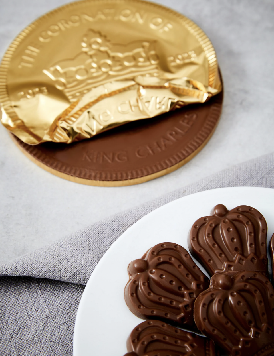 The giant milk chocolate coronation gold coin and 'King of Everything' chocolate crowns are sure to go down a treat. (Marks & Spencer)