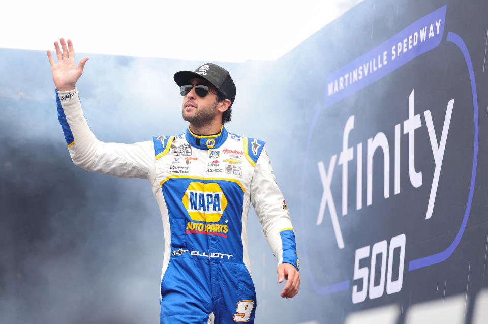 MARTINSVILLE, VIRGINIA - OCTOBER 30: Chase Elliott, driver of the #9 NAPA Auto Parts Chevrolet, waves to fans as he walks onstage during driver intros prior to the NASCAR Cup Series Xfinity 500 at Martinsville Speedway on October 30, 2022 in Martinsville, Virginia. (Photo by Stacy Revere/Getty Images)