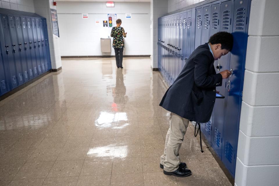 Jason Rheubottom struggles to open his locker at the W.E.B. DuBois Academy. Rheubottom is a sixth grader at the School. Sixth graders had just gotten their lockers for the school year. Oct. 17, 2019.